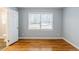 Cozy bedroom with hardwood floors, neutral paint, and ensuite bathroom at 3368 Windsor Castle Ct, Decatur, GA 30034