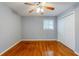 Bedroom featuring hardwood floors, ceiling fan, closet, and natural light at 3368 Windsor Castle Ct, Decatur, GA 30034