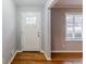 Entryway featuring hardwood floors, a white front door, and a window providing natural light at 3368 Windsor Castle Ct, Decatur, GA 30034