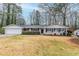 Charming single-story home with gray painted brick and a well-maintained front yard at 3368 Windsor Castle Ct, Decatur, GA 30034
