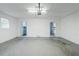 Spacious garage with white walls, concrete floor, and two doors leading to other rooms at 3368 Windsor Castle Ct, Decatur, GA 30034