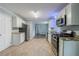 Bright kitchen featuring stainless steel appliances, granite counters and new vinyl flooring at 3368 Windsor Castle Ct, Decatur, GA 30034