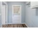 Functional laundry room with half door, overhead rack, and durable flooring at 3368 Windsor Castle Ct, Decatur, GA 30034