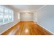 Spacious living room with hardwood floors and plenty of natural light from large windows at 3368 Windsor Castle Ct, Decatur, GA 30034