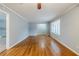 Open-concept living room with hardwood floors, neutral paint, and an open doorway to other rooms at 3368 Windsor Castle Ct, Decatur, GA 30034
