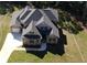 Aerial view of a beautiful two-story home with a large, well-manicured lawn and an attached garage at 8033 White Stone Blvd, Douglasville, GA 30135