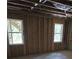Spacious unfinished basement with concrete floors and studded walls at 8033 White Stone Blvd, Douglasville, GA 30135
