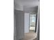 Hallway with large double door and view into bathroom at 8033 White Stone Blvd, Douglasville, GA 30135