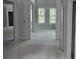 Spacious, light-filled living room with large windows and open floor plan ready for customization at 8033 White Stone Blvd, Douglasville, GA 30135