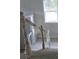 Bright staircase leads to upper level with wooden banister at 8033 White Stone Blvd, Douglasville, GA 30135