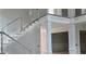 Elegant white staircase showcases detailed trim, offering a grand transition between floors at 8033 White Stone Blvd, Douglasville, GA 30135