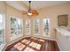 Bright breakfast nook with hardwood floors and scenic window views at 12415 Greenmont Walk, Alpharetta, GA 30009