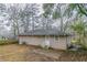 View of the home's backyard, featuring a patio and fenced in yard at 2024 Rosewood Rd, Decatur, GA 30032