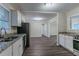 Open kitchen design with stainless steel appliances and a view into the living area at 2024 Rosewood Rd, Decatur, GA 30032