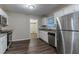 Kitchen featuring stainless steel appliances, white cabinets, and granite countertops at 2024 Rosewood Rd, Decatur, GA 30032
