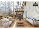 A spacious back deck with seating and stairs to a smaller upper deck offer outdoor living at 3998 Chimney Ridge Dr, Ellenwood, GA 30294