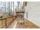 Spacious wooden back deck of home has stairs to a smaller upper deck, providing ample outdoor space at 3998 Chimney Ridge Dr, Ellenwood, GA 30294