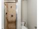 Bathroom featuring a tiled shower with glass door and modern fixtures at 3998 Chimney Ridge Dr, Ellenwood, GA 30294