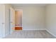 Bright bedroom showcases neutral carpet and a door leading to another room at 3998 Chimney Ridge Dr, Ellenwood, GA 30294