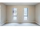 Bedroom with neutral paint, carpet flooring, and bright windows offering natural light at 3998 Chimney Ridge Dr, Ellenwood, GA 30294