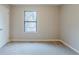 A carpeted bedroom with a window providing natural light at 3998 Chimney Ridge Dr, Ellenwood, GA 30294
