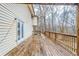 A spacious wooden deck connects the home to its lush, green surroundings at 3998 Chimney Ridge Dr, Ellenwood, GA 30294