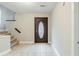 Welcoming entryway with tiled floor and decorative front door with staircase in view at 3998 Chimney Ridge Dr, Ellenwood, GA 30294