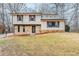 Charming home with stone accents and shuttered windows surrounded by a beautiful wooded landscape at 3998 Chimney Ridge Dr, Ellenwood, GA 30294
