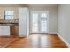 Kitchen with stainless steel appliances, access to a deck, and a view of the backyard at 3998 Chimney Ridge Dr, Ellenwood, GA 30294