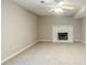 Basement living room features carpet flooring, neutral walls, and a painted fireplace at 3998 Chimney Ridge Dr, Ellenwood, GA 30294
