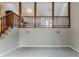 Open living room with views to the upstairs level and stairs at 3998 Chimney Ridge Dr, Ellenwood, GA 30294