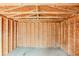 Interior view of outbuilding with wood framing, ready for custom buildout at 3998 Chimney Ridge Dr, Ellenwood, GA 30294