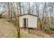 View of the backyard shed with open doors and ramp at 3998 Chimney Ridge Dr, Ellenwood, GA 30294