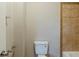 This bathroom features a white toilet in a room with tile flooring and neutral walls at 3998 Chimney Ridge Dr, Ellenwood, GA 30294