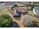 An aerial view of a home showcasing a spacious, fenced backyard at 1553 Nicole Ridge Ct, Loganville, GA 30052