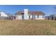 Spacious backyard featuring lush lawn and a patio with furniture, perfect for outdoor relaxation and entertaining at 1553 Nicole Ridge Ct, Loganville, GA 30052