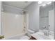 The bathroom features a shower and tub combination, a white toilet, and a stylish vanity sink at 1553 Nicole Ridge Ct, Loganville, GA 30052