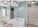 Bathroom featuring a double sink vanity, large mirror, and stylish fixtures at 1553 Nicole Ridge Ct, Loganville, GA 30052
