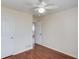 Bedroom featuring beautiful laminate wood floors, a ceiling fan, and an open doorway, creating a seamless flow at 1553 Nicole Ridge Ct, Loganville, GA 30052
