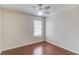 A charming bedroom featuring wood laminate flooring and a ceiling fan, offering a cozy retreat at 1553 Nicole Ridge Ct, Loganville, GA 30052