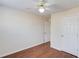 A bedroom featuring laminate wood floors, ceiling fan, and closet, offering a comfortable space at 1553 Nicole Ridge Ct, Loganville, GA 30052
