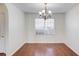 A formal dining room with hardwood floors and chandelier lighting at 1553 Nicole Ridge Ct, Loganville, GA 30052