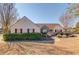 Charming single-story home featuring manicured landscaping and red shutters at 1553 Nicole Ridge Ct, Loganville, GA 30052