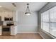 Bright kitchen nook with stainless steel appliances and a large window for ample natural light at 1553 Nicole Ridge Ct, Loganville, GA 30052