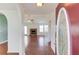 Living room featuring a stone fireplace, hardwood floors and natural light at 1553 Nicole Ridge Ct, Loganville, GA 30052