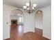 Open floor plan with arches featuring a fireplace and hardwood floors at 1553 Nicole Ridge Ct, Loganville, GA 30052