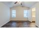 Bedroom featuring wood floor, windows for natural light, and an ensuite bathroom at 2464 Hampshire Cv, Conyers, GA 30013