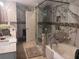 A luxurious bathroom featuring marble, decorative tile, and a glass enclosed shower at 2610 Gadsen Walk, Duluth, GA 30097