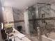 A large bathroom showcasing a seamless glass shower, a soaking tub, and ample counter space at 2610 Gadsen Walk, Duluth, GA 30097