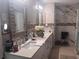 A primary bathroom with double vanity sinks, a walk-in shower, and decorative fixtures at 2610 Gadsen Walk, Duluth, GA 30097